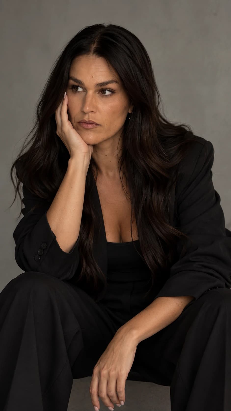 AI portrait of Sandra resting her face on her hand.
